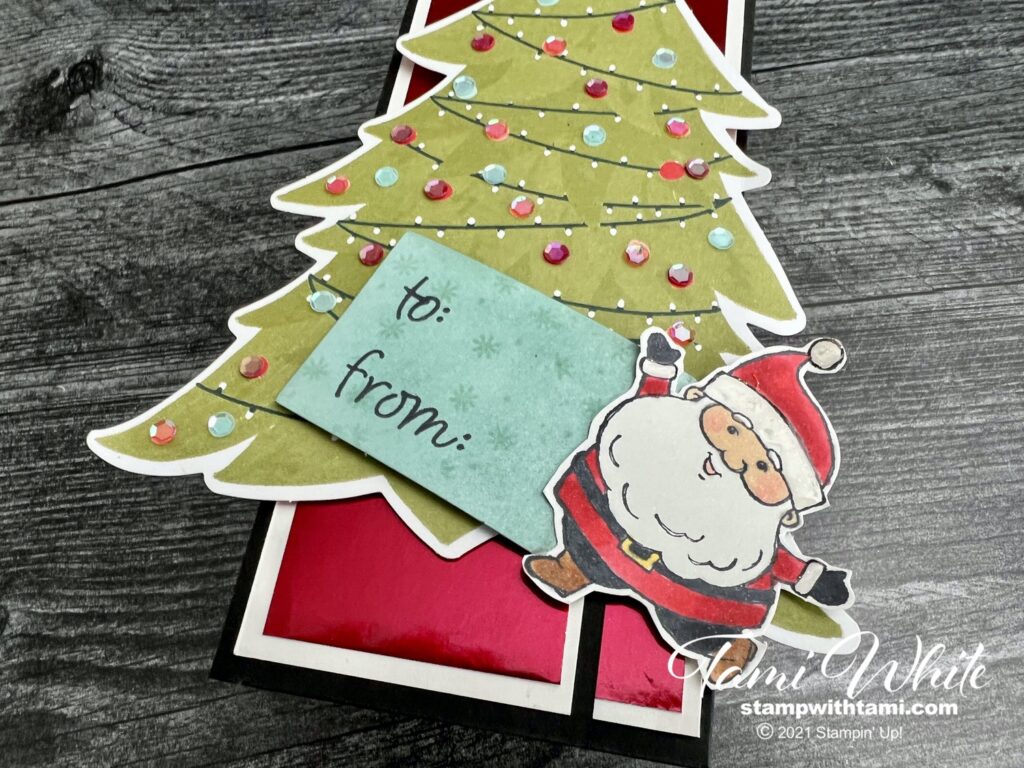 Santa is colored with Stampin' Blends markers. I used Shimmer White cardstock to add some sparkle. The hat and trim on Santa's suit has a touch of Shimmery Crystal Effects. I used the Blending Brushes to color one of the white tags from the kit.