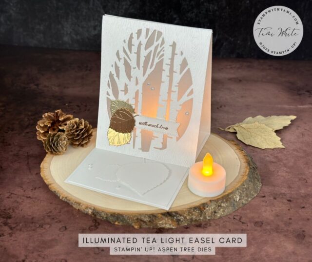 TEA LIGHT CARD SERIES #4  This illuminated tea light easel card is stunning and simple. I created it with the Stampin' Up! Aspen Tree Dies. These dies carried over from the Holiday Mini catalog and the oval framed trees are perfect for the window. I did white on white with a pop of foil with leaves cut using scraps from the Metallics Specialty paper.   The first 3 easel cards in this series were created landscape. I created this card in portrait orientation so it stands tall, but it still folds flat to standard 5-1/2" x 4-1/4" card size. 

